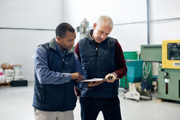Aufkleber - Supervising operations has never been easier. Shot of two factory managers doing a warehouse inspection.