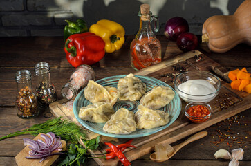 close up view of delicious food, dumplings and vegetables on wooden table