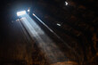 © Parashar Mangela - sun rays enter through the broken roof in house.