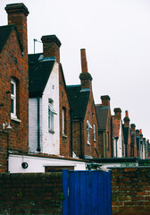 Wall Mural - English row flats house in spring season, England UK. Brick building in the town.