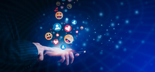 Hand holding smartphone and Social media and digital online concept, smart phone with Social media, concept of living on vacation and playing social media. Social Distancing