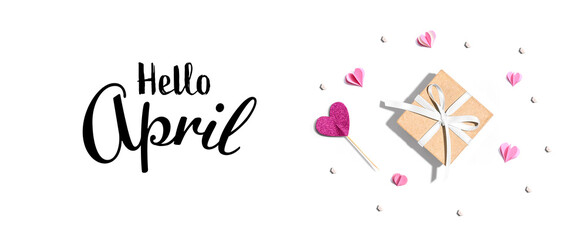 Wall Mural - Hello April message with a small gift box and paper hearts