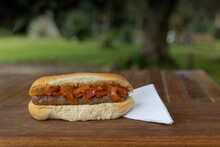 Boerewors Roll With Relish On A Wooden Board