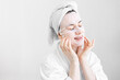 © puhimec - Young woman with sheet mask on her face, spa procedure.