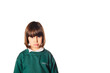 © JORGE CORCUERA - Cute angry little five years old girl with a negativity expression and a juniors school uniform. she is angry about going back to school. isolated white background