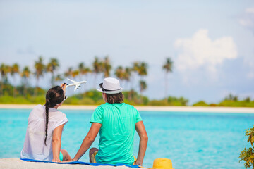 Wall Mural - picture of happy couple in sunglasses on the beach