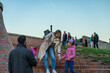 © DusanJelicic - Mother and daughter go to meet the father who bought flowers to surprise them.