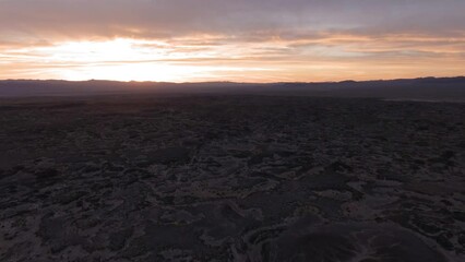 Canvas Print - Aerial view of lava field at sunset in Mojave Desert, California