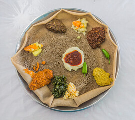 Typical meal in Ethiopia - Beyainatu. Meaing bit of everything. Mix of vegetables and stews on injera flatbread.