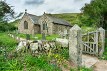 Old Stone Gateway Leading Into The Grounds Of Of Saint Winwaloe's Church,Cornwall,Gunwalloe,southwest England,UK.