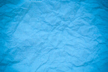 Blue Crumpled Paper Background.