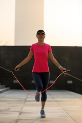 Poster - Fitness asian woman jumping rope