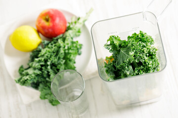 Wall Mural - Blender filled with kale, apple and lemon.