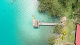 Fototapeta Do pokoju - Muelle en la laguna de 7 colores de Bacalar mexico 