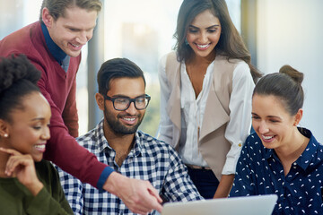 Poster - Using digital marketing to grow their business. Shot of coworkers discussing something on a laptop during a meeting.