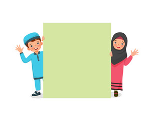 Poster - happy Muslim kids little boy and girl peeking from behind blank billboard smiling and waving hands showing copyspace for advertising and announcement messages