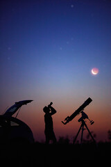 Wall Mural - silhouette of a man, car, telescope and countryside under the starry skies.