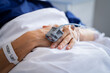 © Rido - Patient hands with IV drip in hospital