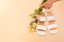 Fashion - Spring Or Summer Footwear For Woman. White Dress Sandals Shoes On Beige Background.