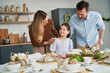 © gpointstudio - Caucasian family before an easter dinner at home