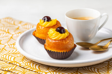 Sticker - A rum baba or baba au rhum, small yeast cake saturated in syrup made with hard liquor, with custard cream and black cherries and espresso coffee.  Italian pastry.