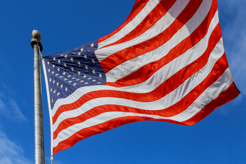 Sign of patriotism of American flag waving on flagpole