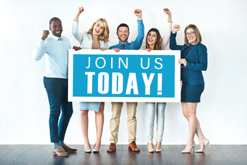 Poster - We want you on our team. Studio shot of businesspeople holding up a sign with the words join us today on it and cheering.