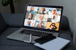 © Angelov - Laptop screen with multi-person conference, collage of group of multiracial people, webcam view, video chat. A lot of different headshots on computer monitor, virtual conference, video call.