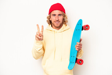 Wall Mural - Young skater caucasian man isolated on white background showing number two with fingers.