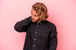 © Asier - Young caucasian man isolated on pink background having a neck pain due to stress, massaging and touching it with hand.