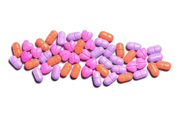 Wall Mural - Closeup shot of a pile of colorful pills on white background.