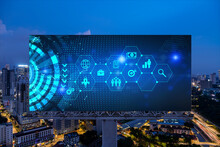 Research And Technological Development Glowing Icons On Billboard. Night Panoramic City View Of Kuala Lumpur. Concept Of Innovative Activities Expanding New Services Or Products In Malaysia, Asia.