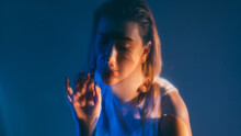 Sensitive Woman. Art Portrait. Loneliness Melancholy. Double Exposure Defocused Silhouette Of Tranquil Female Face Isolated On Dark Blue Copy Space Background Out Of Focus.
