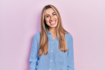 Sticker - Beautiful hispanic woman wearing casual shirt with a happy and cool smile on face. lucky person.