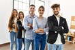 © Krakenimages.com - Group of young business workers smiling happy standing with arms crossed gesture at the office.