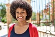 © Krakenimages.com - Young african american girl smiling happy standing at the city.