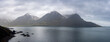 © SNEHIT PHOTO - Panoramic view of tall mountains in Iceland along northern Atlantic shore line under cloud cover