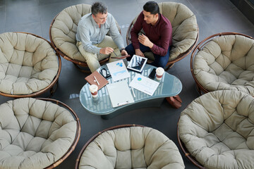 Canvas Print - Finance department managers analyzing reports at meeting, view from the top