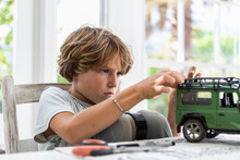 Boy (8-9) Building Car Model Toy