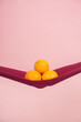© ChristopherTP - four oranges cut in half on a red cloth in front of a peach background as a symbol of the pelvic floor