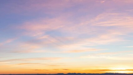Wall Mural - Cinemagraph. View of colorful cloudscape with blue Sky in Background during a sunny winter sunset. Taken in Vancouver, British Columbia, Canada. Loop Animation