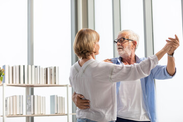 Wall Mural - senior couple, elderly man and woman dancing together in free time