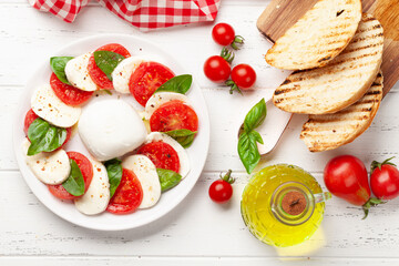 Canvas Print - Caprese salad with mozzarella, basil and garden tomatoes