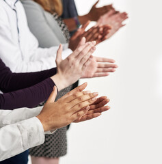 Poster - Well done. Shot of a group of people clapping their hands together.