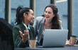 © Nicholas F/peopleimages.com - The partnership to outperform any other. Shot of two young businesswomen using a laptop during a meeting at a coffee shop.