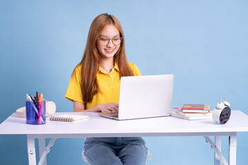 Wall Mural - Young Asian student studying concept