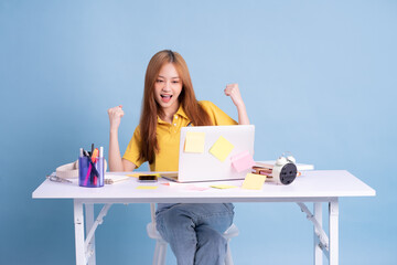 Wall Mural - Young Asian student studying concept