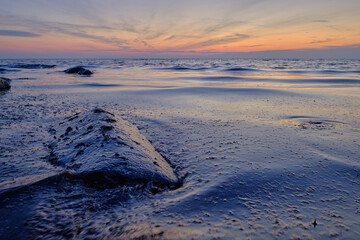 Wall Mural - rocks in the sea at sunset