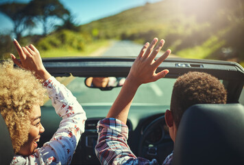 Nothing better than a road trip with your favorite person. Cropped shot of a happy young couple out on a road trip.