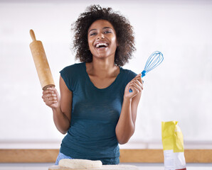 Wall Mural - Which one is called the rolling pin. Young woman preparing dough in her kitchen.